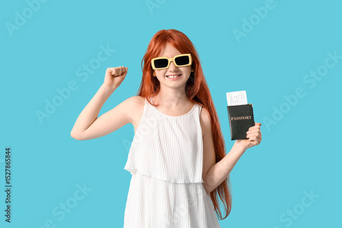 Excited young girl with red...