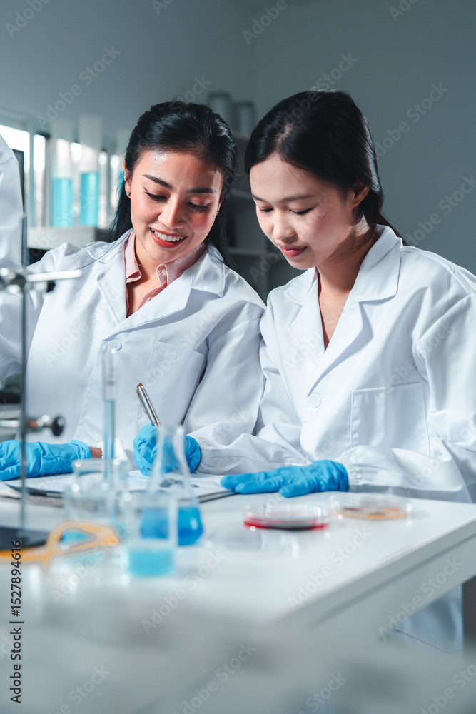 A female scientist in a white lab coat and blue gloves closely examines a petri dish with visible mold cultures, showcasing focus and expertise in microbiological analysis and lab research. A female scientist in a white lab coat and blue gloves closely examines a petri dish with visible mold cultures, showcasing focus and expertise in microbiological analysis and lab research.
