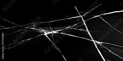 Shattered black surface with intricate cracks