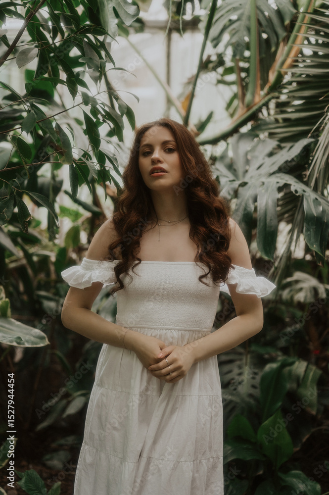 Woman in a White Dress is walking in a park, soft-focus trendy image. Woman in a White Dress is walking in a park, soft-focus trendy image.