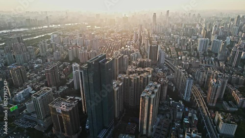 Wallpaper Mural Overhead of guangzhou zhujiang new town at dusk showcases dense buildings, river and elevated highway Torontodigital.ca