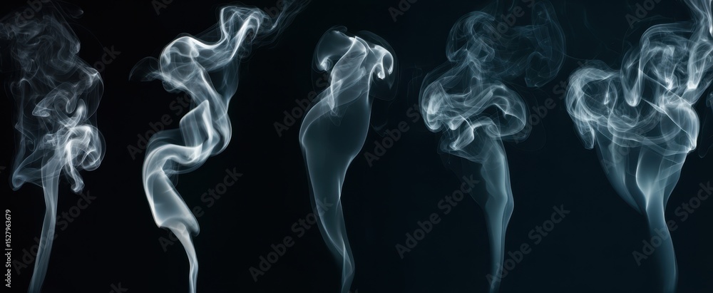 Fototapeta premium The beautiful smoke formations gracefully dancing against a dark background.