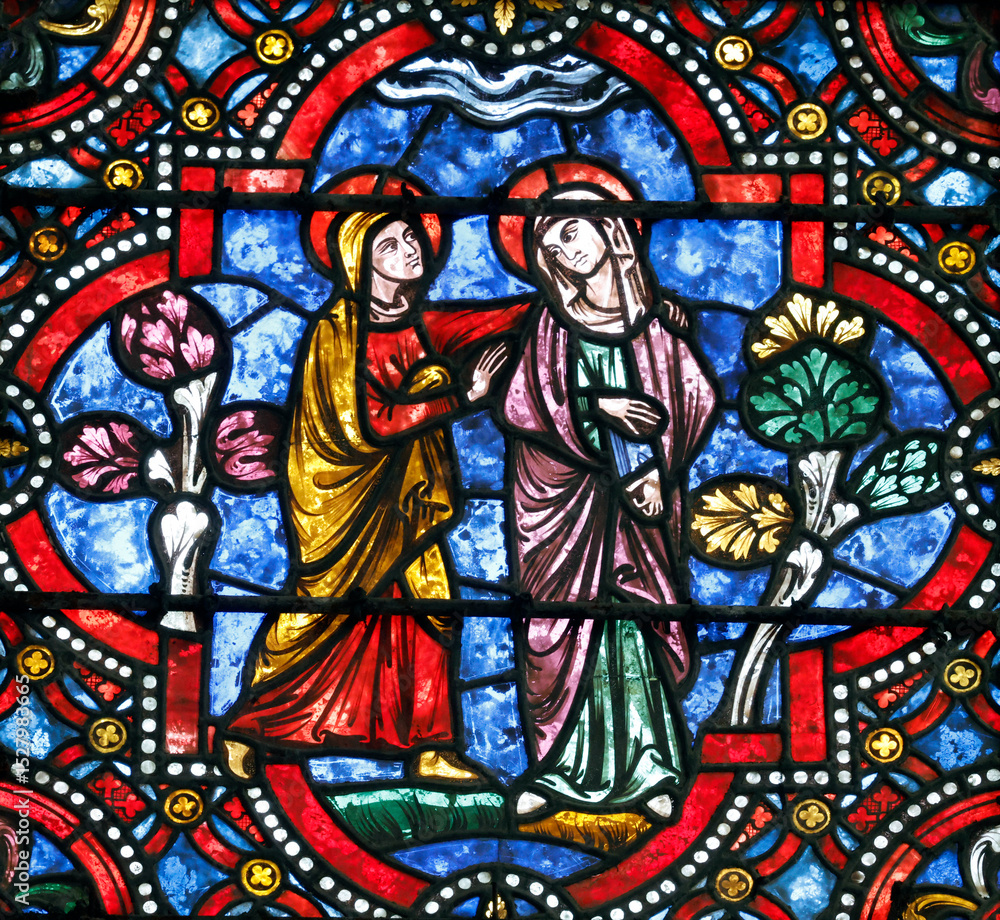 Auxerre cathedral. Stained glass. The Visitation of the Virgin is the visit of Mary with Elizabeth as recorded in the Gospel of Luke. Auxerre. France. Auxerre cathedral. Stained glass. The Visitation of the Virgin is the visit of Mary with Elizabeth as recorded in the Gospel of Luke. Auxerre. France.