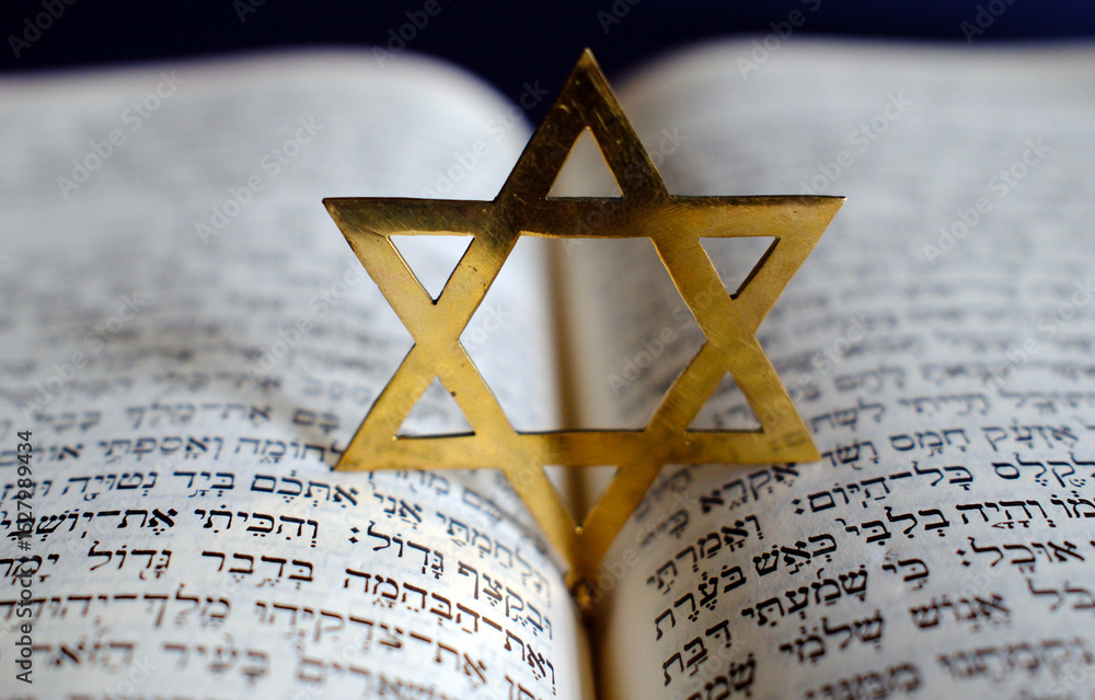 Fototapeta premium Judaism. The Bible in Hebrew with a star of David.