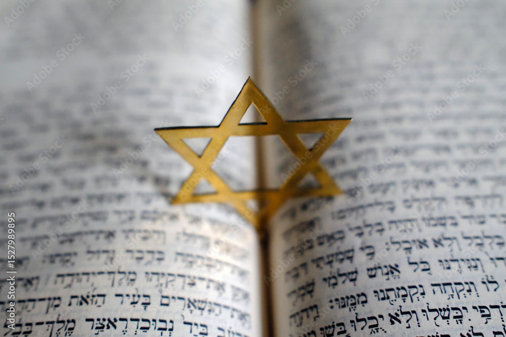 Fototapeta premium Judaism. The Bible in Hebrew with a star of David.