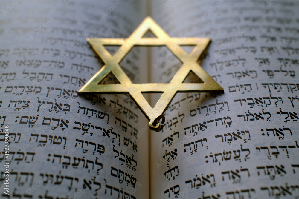 Fototapeta premium Judaism. The Bible in Hebrew with a star of David.