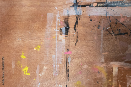Art studio messy wooden desk texture with colourful paint splatters, artist painter's table background