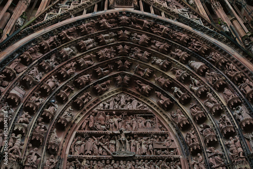 Detailed view of the door and sculptures of the Notre-Dame de Strasbourg cathedral, a masterpiece of Gothic art and historical monument of France.