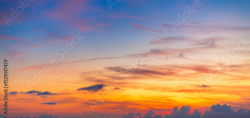 Colorful sky backdrop in the morning,Nature beautiful Light Sunset or sunrise sky,Sunset Sky Background in the Evening with Dramatic Dusk Clouds and Colorful Pink, Orange Sunlight on Blue Twilight sky