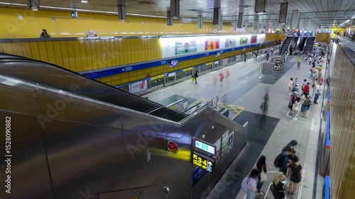 top down timelapse view of crowded passenger get on and get off from subway train while train arrive and depart from platform in rush hour. Timelapse view of people at taipei underground station