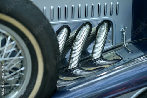 Ταπετσαρία Side exhaust pipes and wire spare wheel with whitewall tire on a blue vintage lu