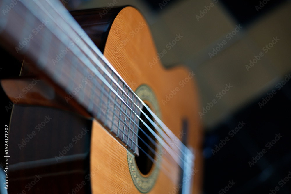 Fototapeta premium Musical instrument. Close-up of the strings of a guitar.