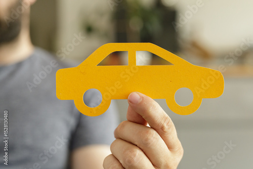 Image of a hand holding a y...