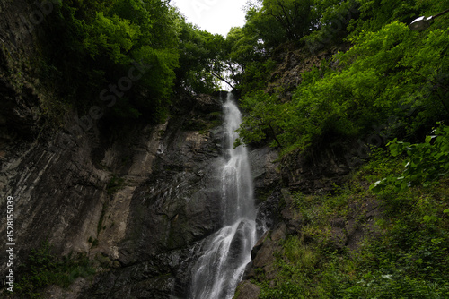 Mountain waterfall in Georgia. a weak waterfall in the mountains