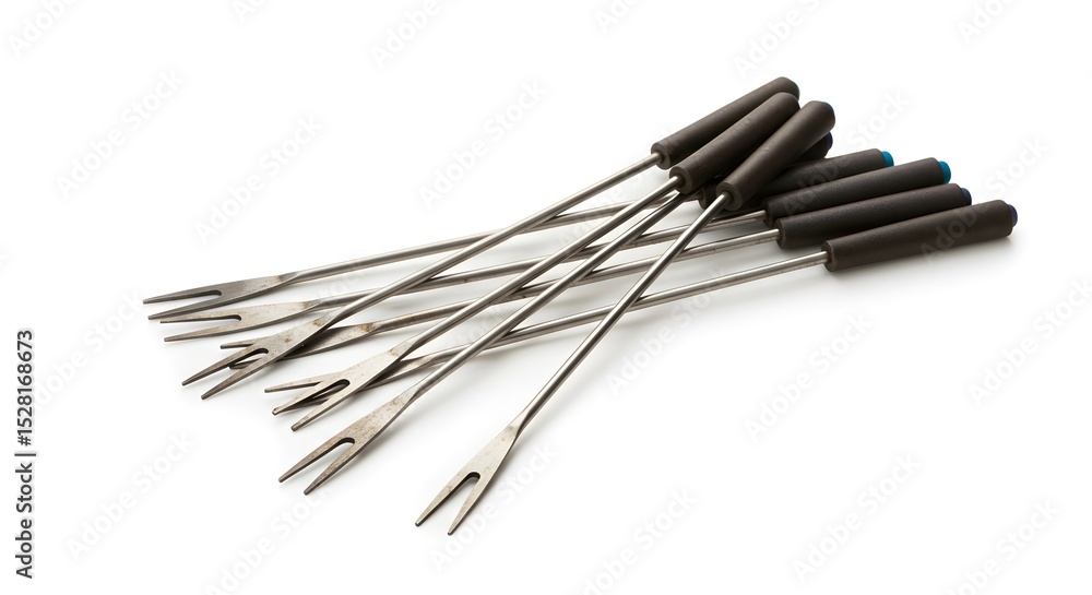 Cast iron fondue forks set isolated on white background Cast iron fondue forks set isolated on white background