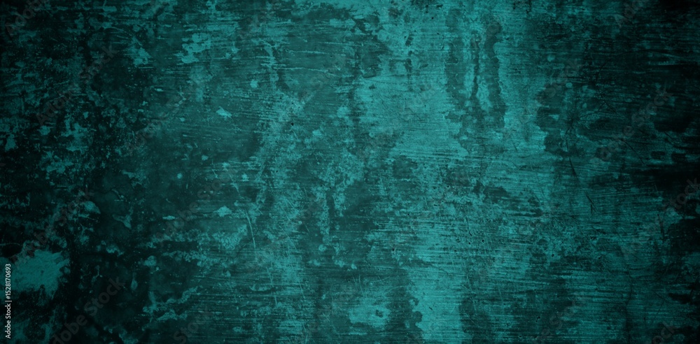 Obraz premium A textured background featuring a deep teal color with a distressed, grunge appearance. The surface shows variations in tone and subtle patterns, creating an abstract and moody aesthetic.