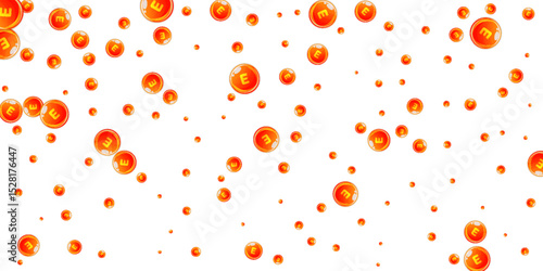 Vitamin E round capsules scattered randomly.