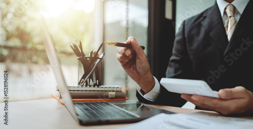 Accountant working with computer tablet in modern office, preparing accounting analysis report, real estate investment information, financial and tax system concept.