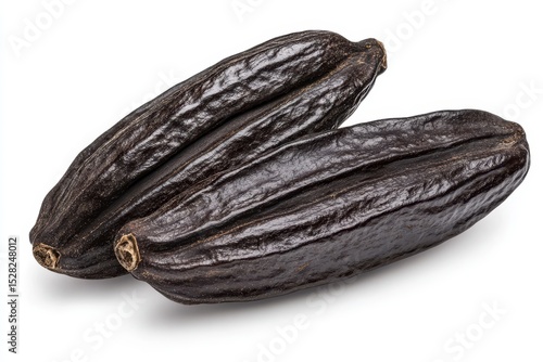 Wallpaper Mural Two dark brown vanilla beans, isolated on white background, showing their rich texture and aromatic qualities Torontodigital.ca