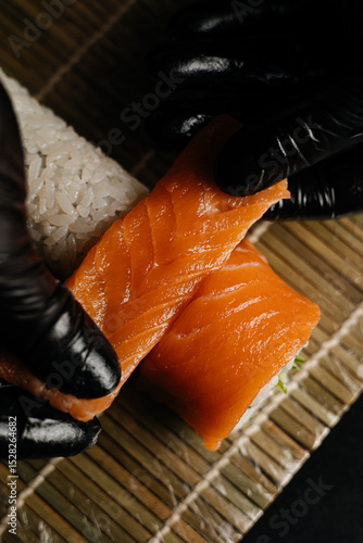 Sushi Chef Rolling Fresh Salmon Sushi