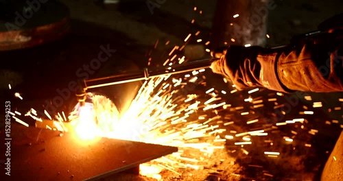 Smelting metal in a metallurgical plant. Liquid iron from metal ladle pouring in castings at factory	