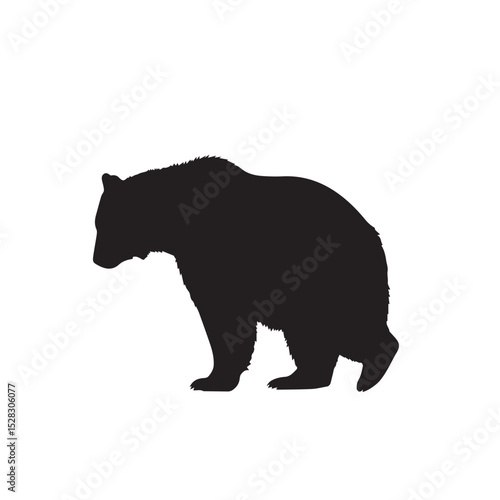Black silhouette of a bear walking sideways