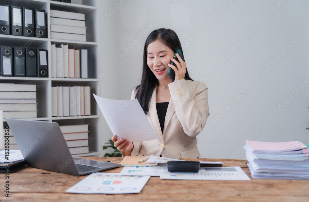 Asian Businesswoman Working at Desk Asian Businesswoman Working at Desk