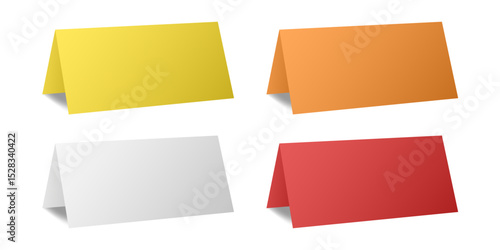 Set of table cards. White, yellow, orange and red bent sheets. Tent table card, nameplate