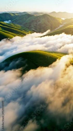 Morning Fog Rolling Over Green Hills at Sunrise