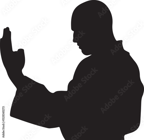 Silhouette of a Man in a Robe Practicing Martial Arts