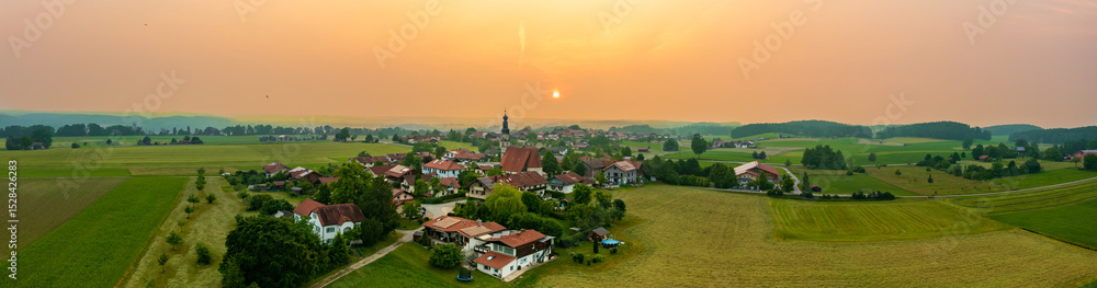 Fototapeta premium Aerial view: Bavarian village at sunset