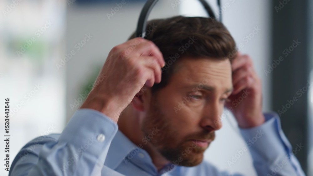Operator hand taking headset start work in call center closeup. Sales manager Operator hand taking headset start work in call center closeup. Sales manager