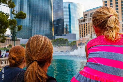 Young Girl Watching  the Fountains on Las Vegas Boulevard With Her Mother and Grandmother, Las Vegas, Nevada, USA