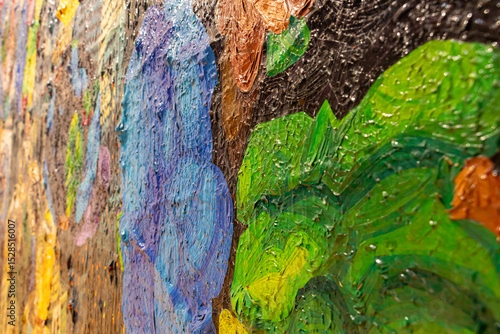 A close-up view of a vibrant and expressive painting created with the help of clippings