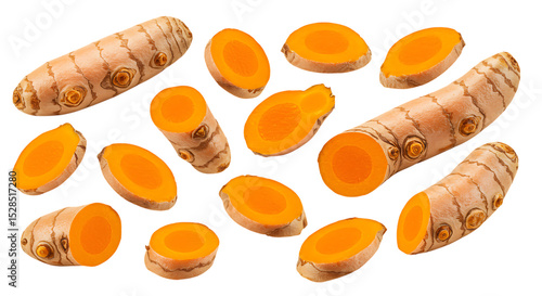 Fresh turmeric root slices and whole pieces isolated on white background