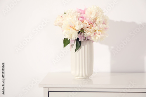 Wallpaper Mural Bouquet of beautiful peonies on table near white wall Torontodigital.ca