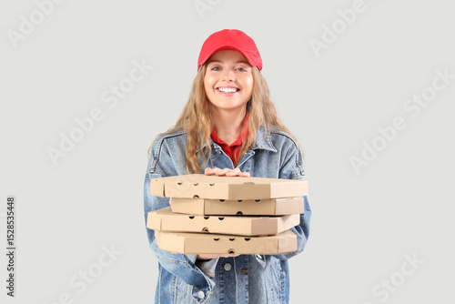 Female courier holding many...