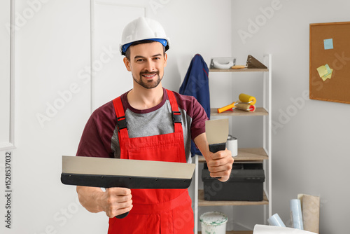 Male decorator with putty k...