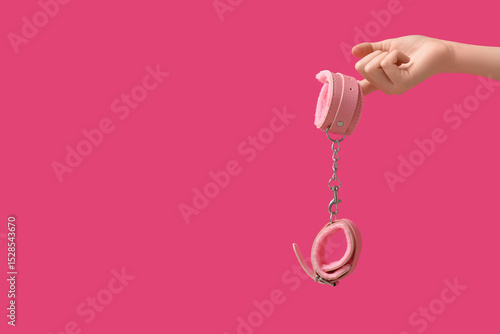 Female hand with handcuffs ...