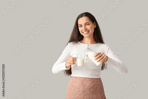 Young woman with glass and ...