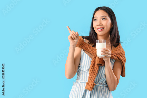 Young Asian woman with glas...