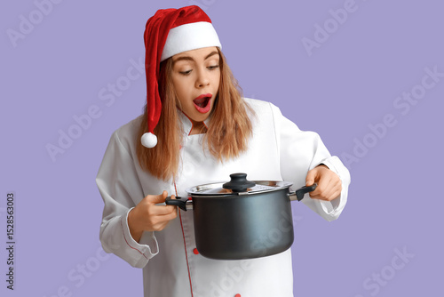 Young female chef in Santa ...