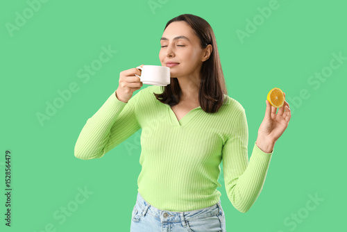 Young woman with cup of tea...