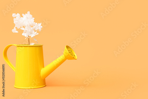 Yellow watering can with wh...