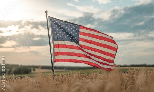 American flag waves in wheat field at sunset