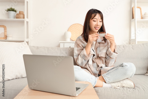 Young Asian woman with frie...