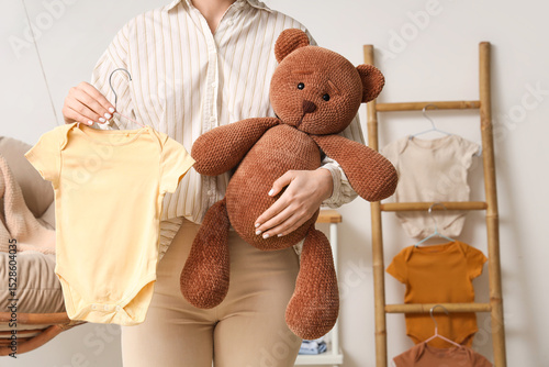 Young woman with baby bodys...