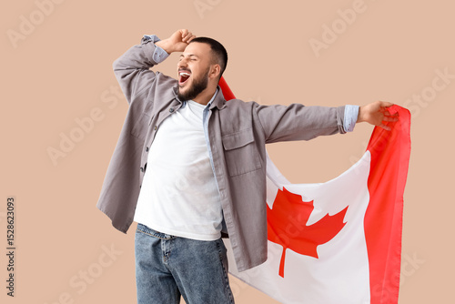 Young man with flag of Cana...