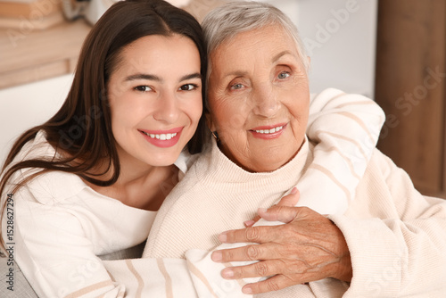 Young woman hugging her gra...