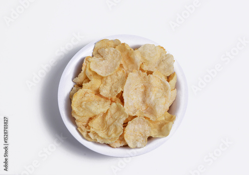 Deep-fried Emping, a type of Indonesian chip made from melinjo nuts, has a slightly bitter taste and is often served as a snack or accompaniment to Indonesian dishes.